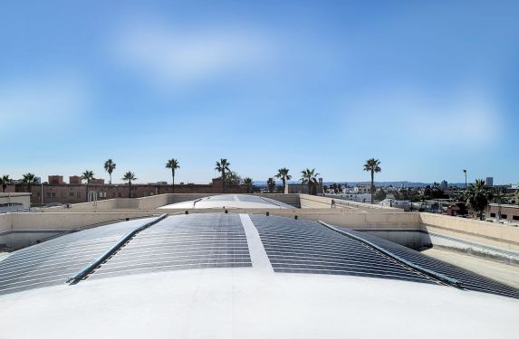 Merlin Solar panels sit on a curved roof.