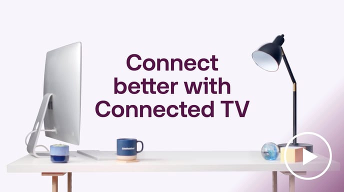 Desk with computer and lamp beside ‘Connect better with Connected TV’ text by The Trade Desk, promoting CTV advertising.