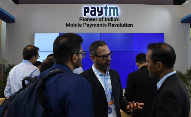 people in front of Paytm signage