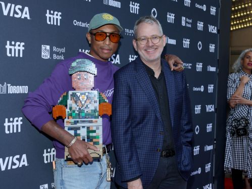 Pharrell Williams and Morgan Neville attend the premiere of "Piece by Piece" at Princess of Wales Theatre on September 10, 2024 in Toronto, Ontario