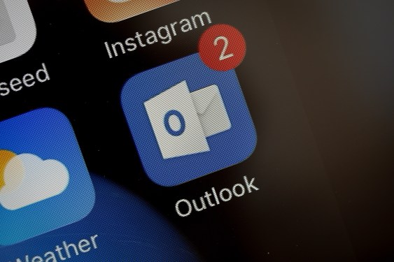 A photo of the icon for the Microsoft email app Outlook.