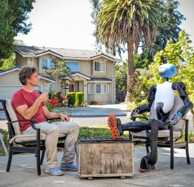 man chilling on patio with Kind Humanoid robot