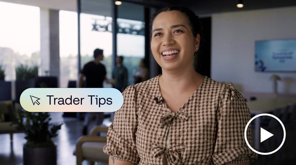 Photo of Marjorie Panknin, an industry trader, smiling at the camera with a Trader Tips logo and play button overlaid
