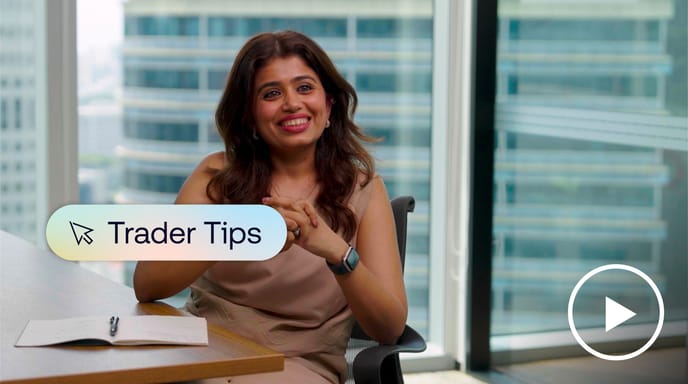 Smiling woman sitting at desk in city office.