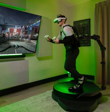 person using Virtuix Omni One VR treadmill